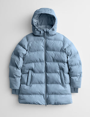 Blue puffer jacket on a light gray background. 