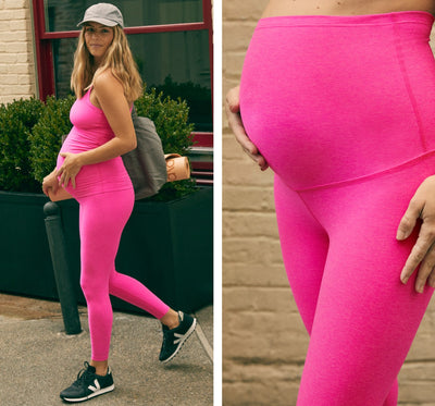 model is wearing a pink maternity tank top and pink maternity midi leggings. 
