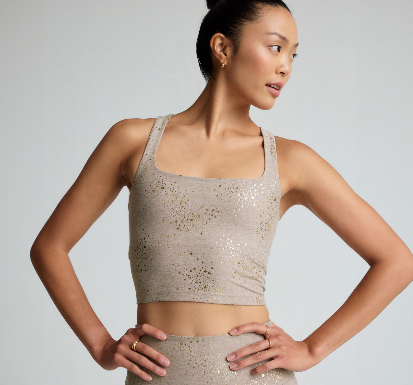 brown square neck cropped tank with a star sparkle print. 