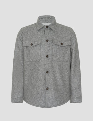 gray shirt jacket with button details on a light gray background. 