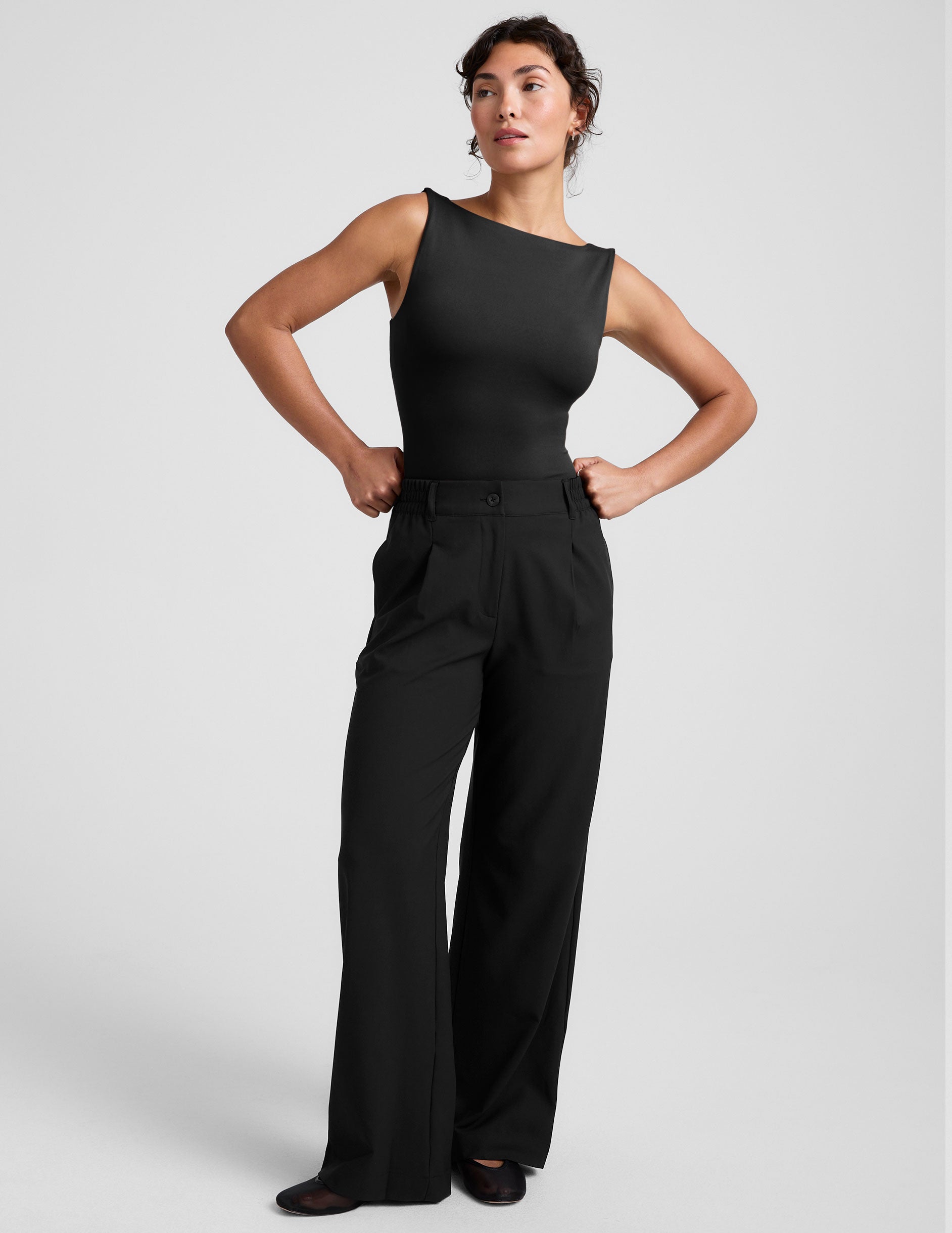 black boat neck tank top with a square back neckline. 