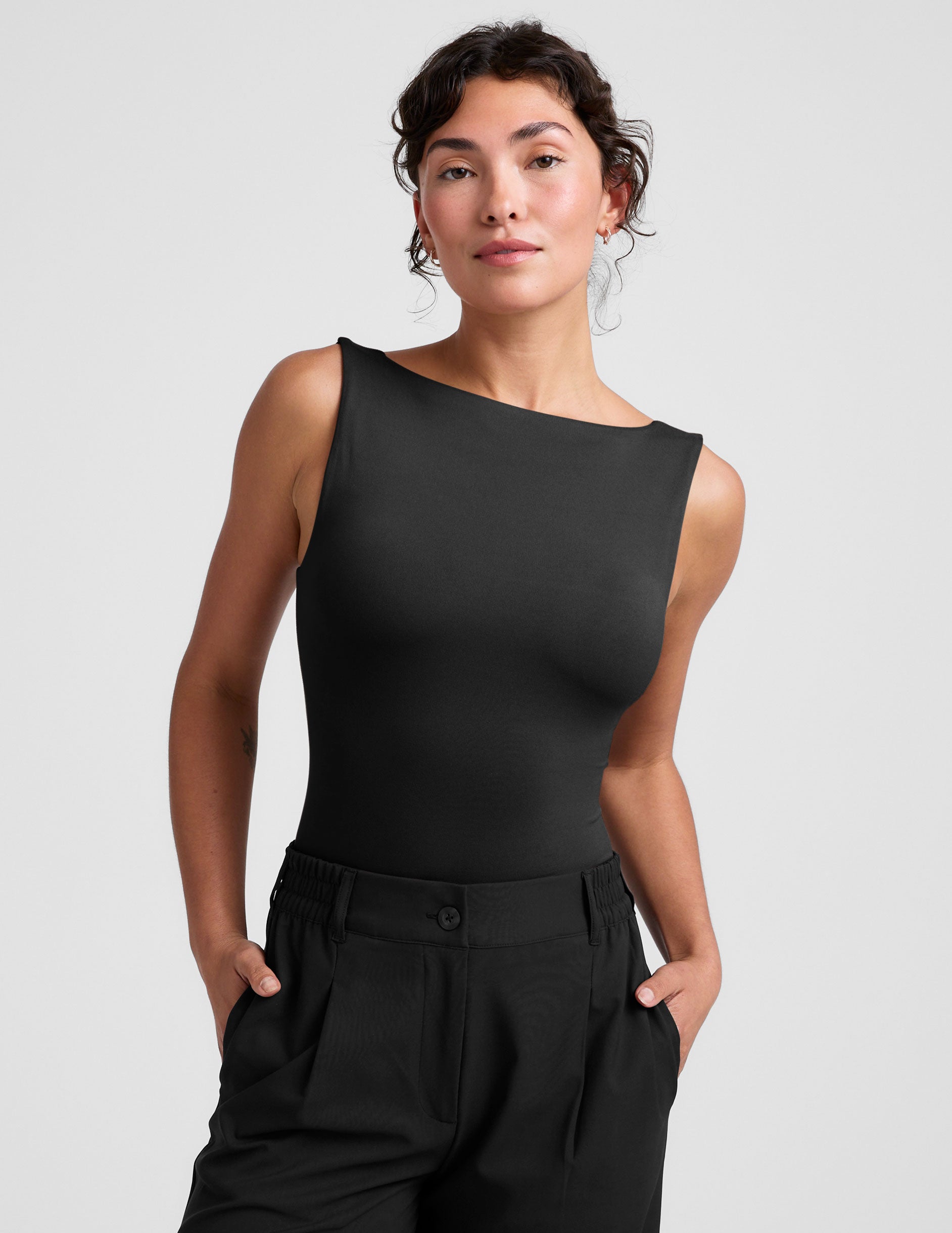 black boat neck tank top with a square back neckline. 
