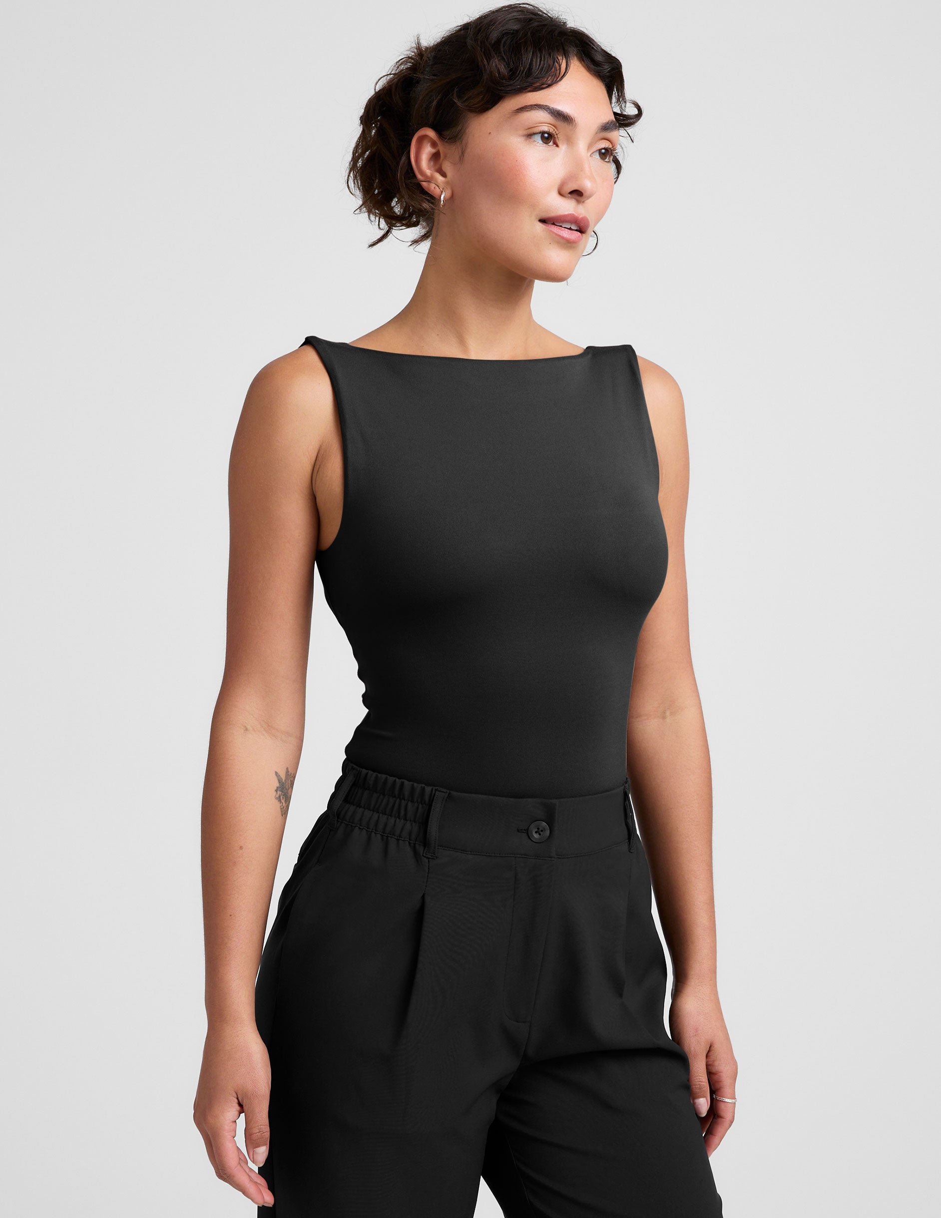 black boat neck tank top with a square back neckline. 