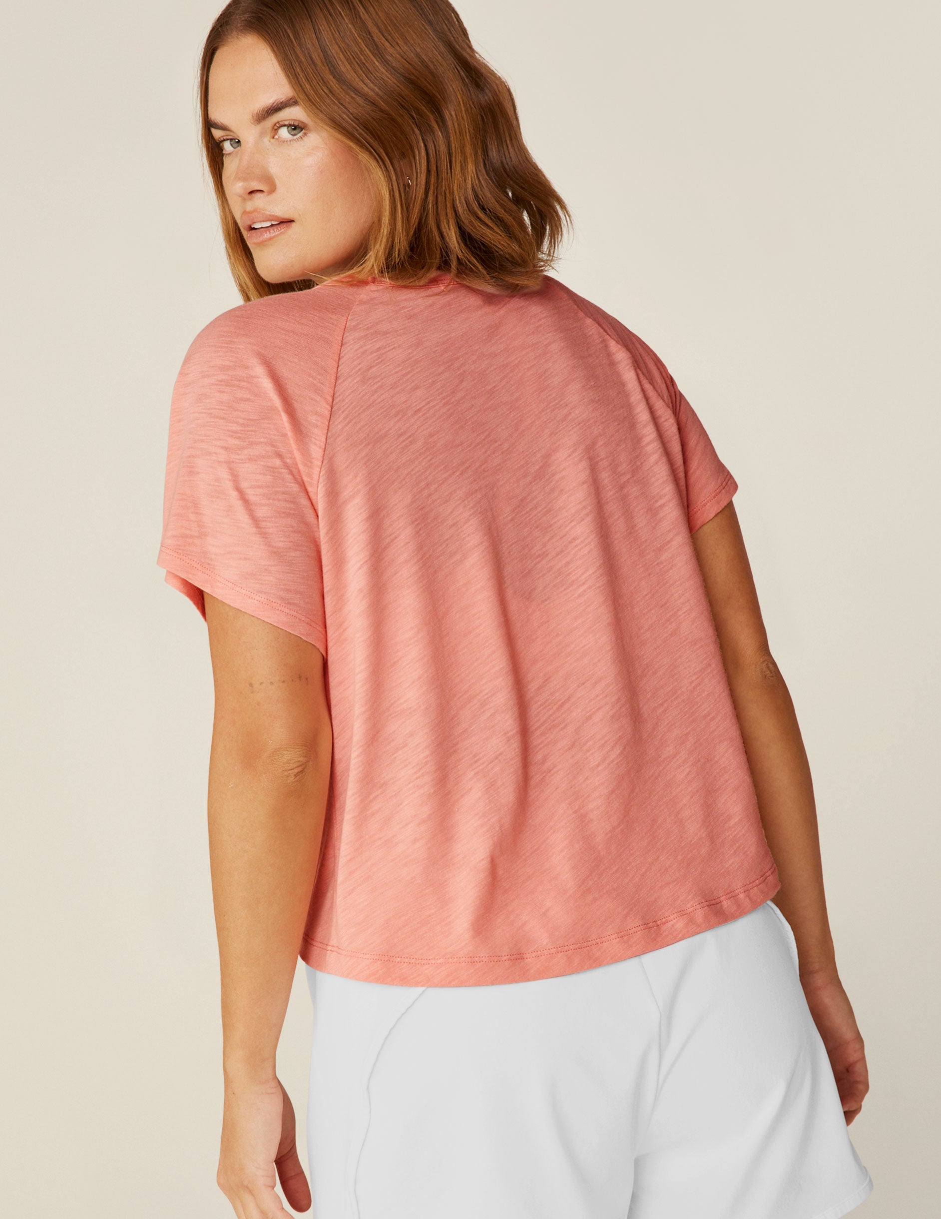 pink v-neck high-low cropped top.