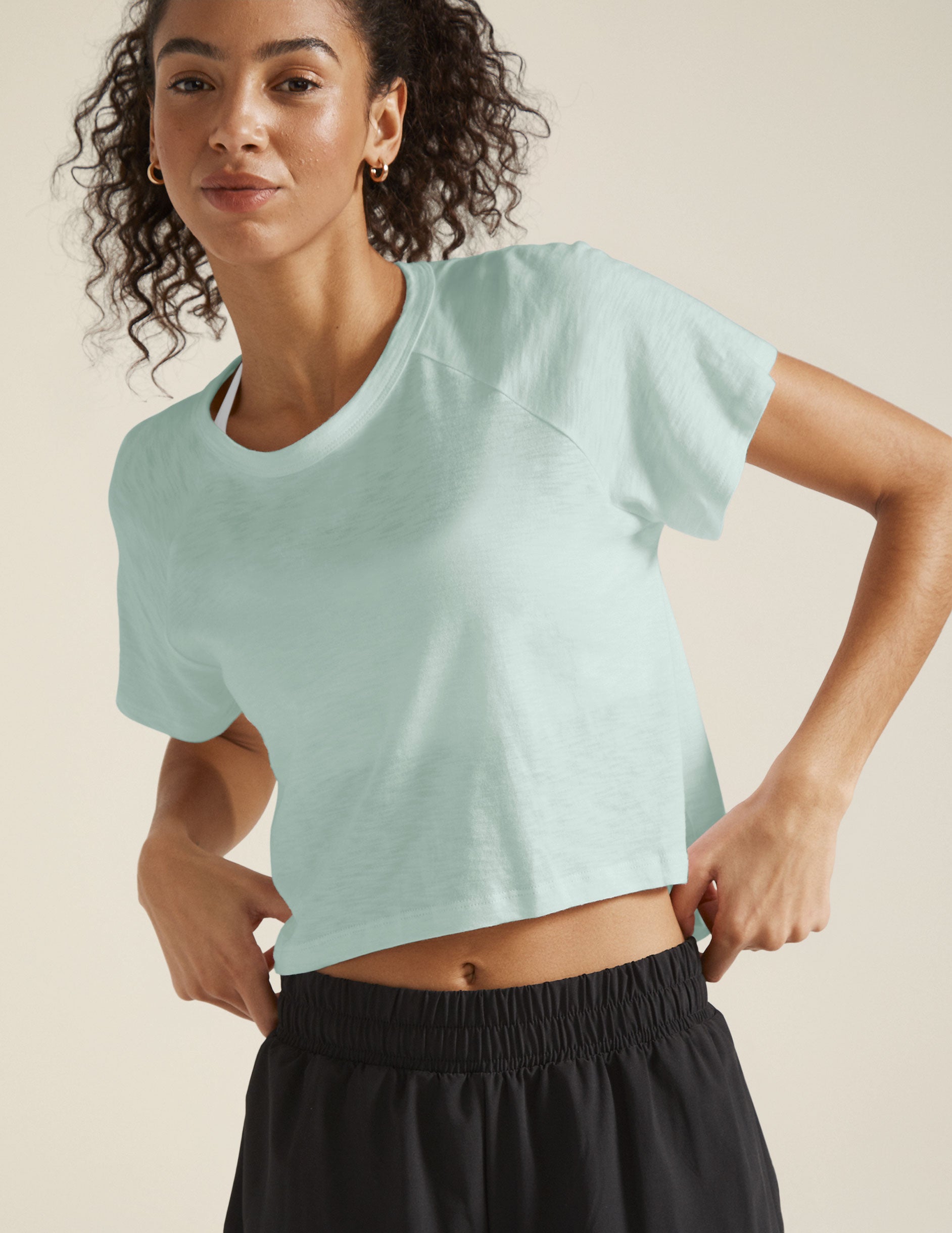 blue crew neck short sleeve high low cropped tee. 