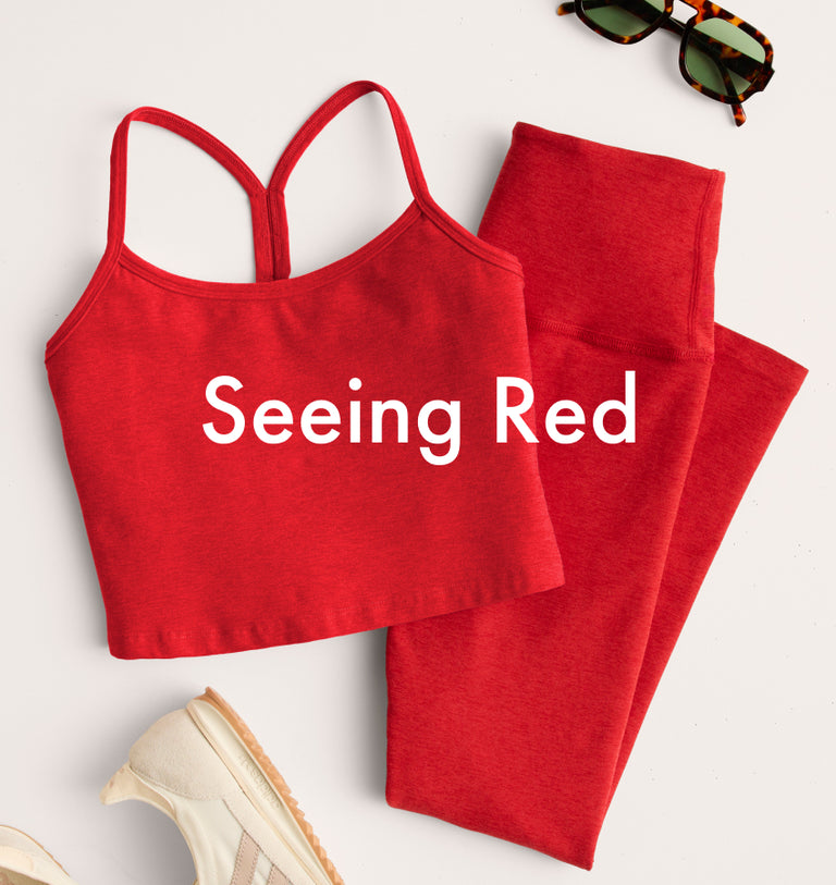 red slim racerback cropped tank and red high-waisted midi leggings. 