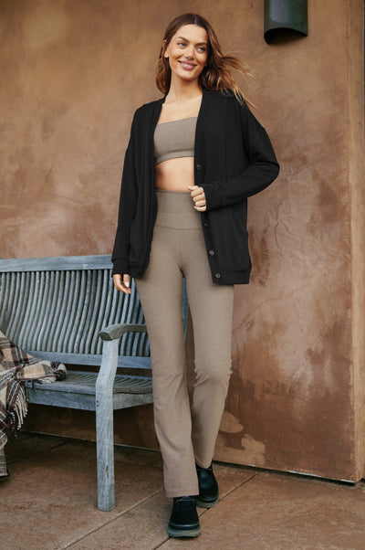 model is wearing a brown bra top, black button-up cardigan, and brown straight leg leggings. 