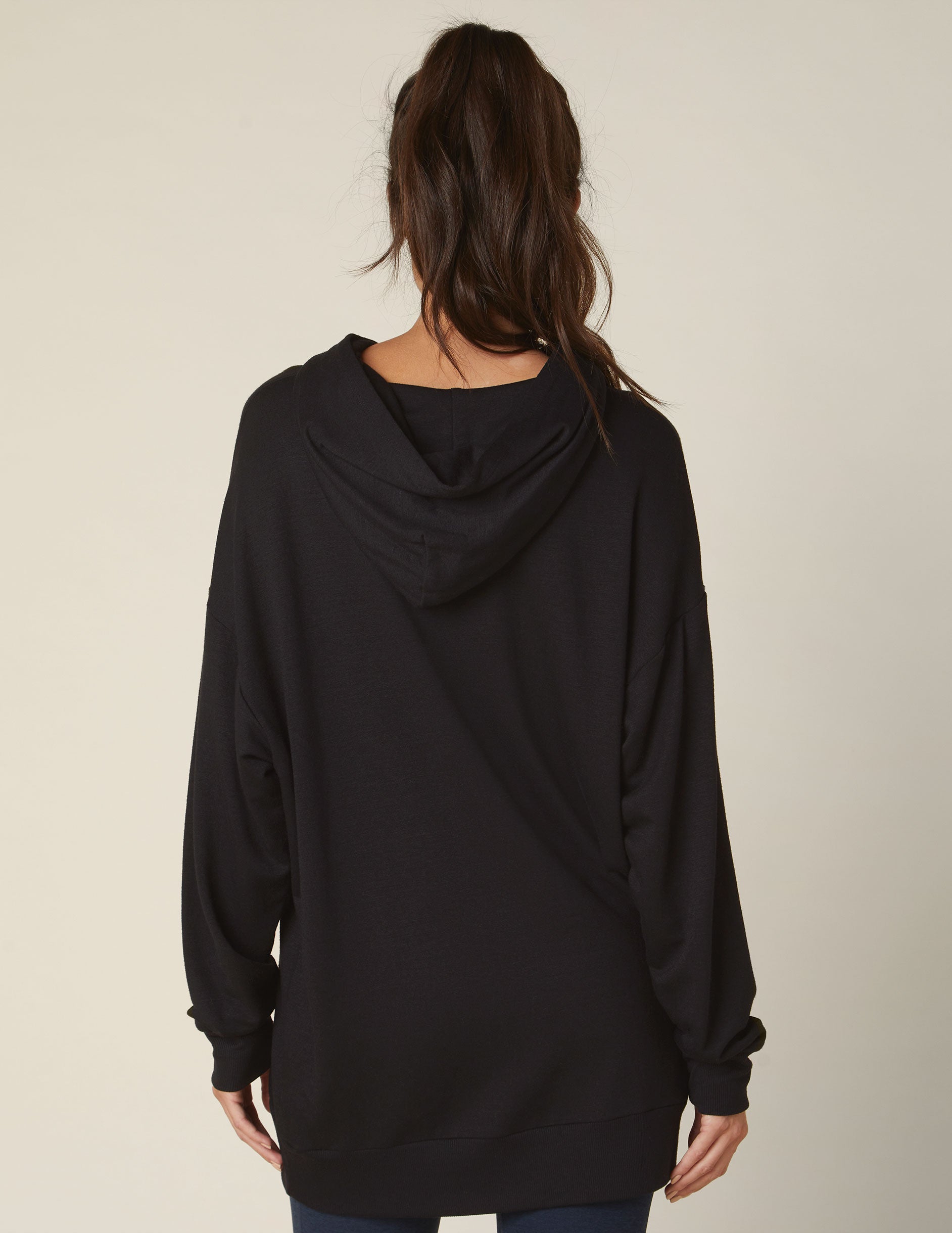 black oversized fit hoodie with a kangaroo pocket. 