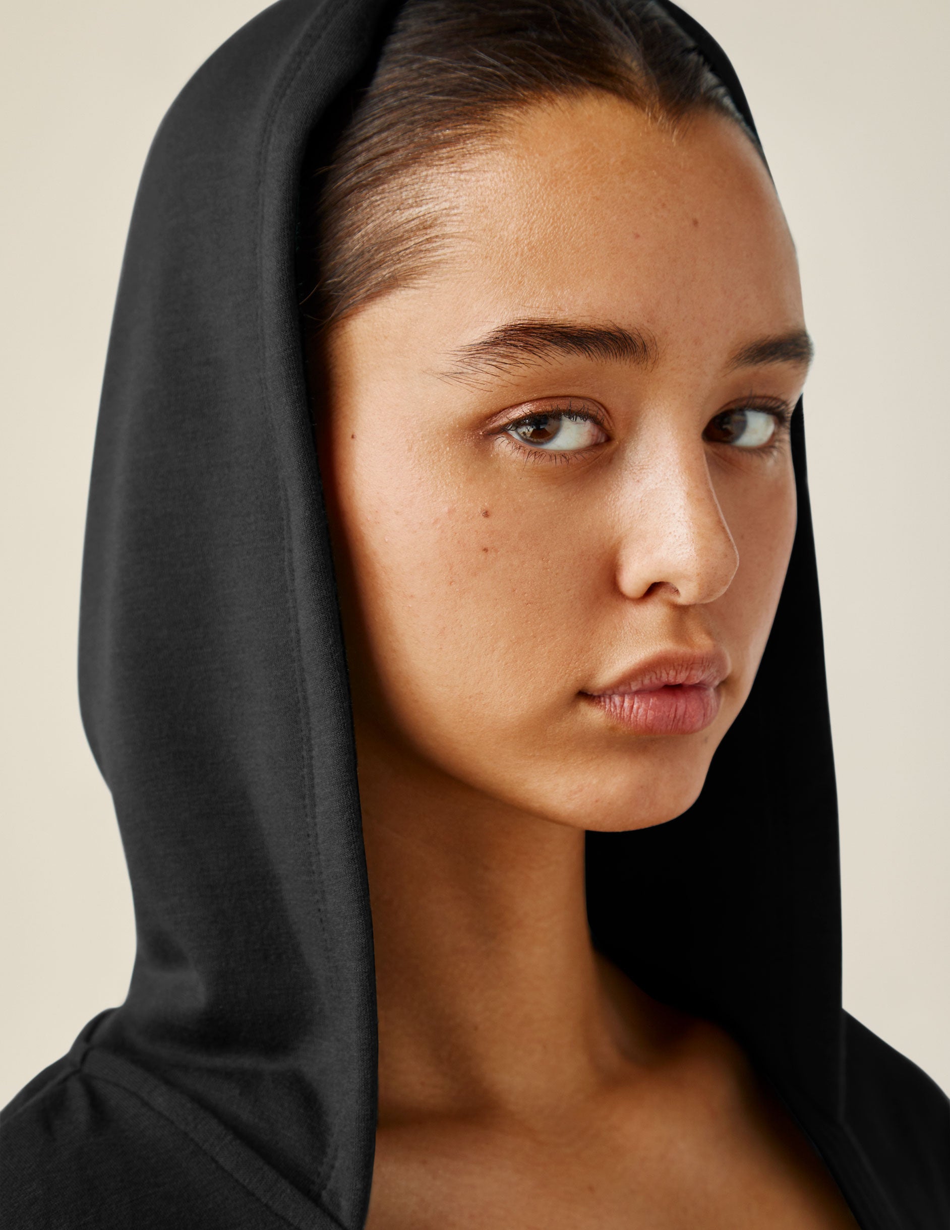 black hooded pullover with front crossover
