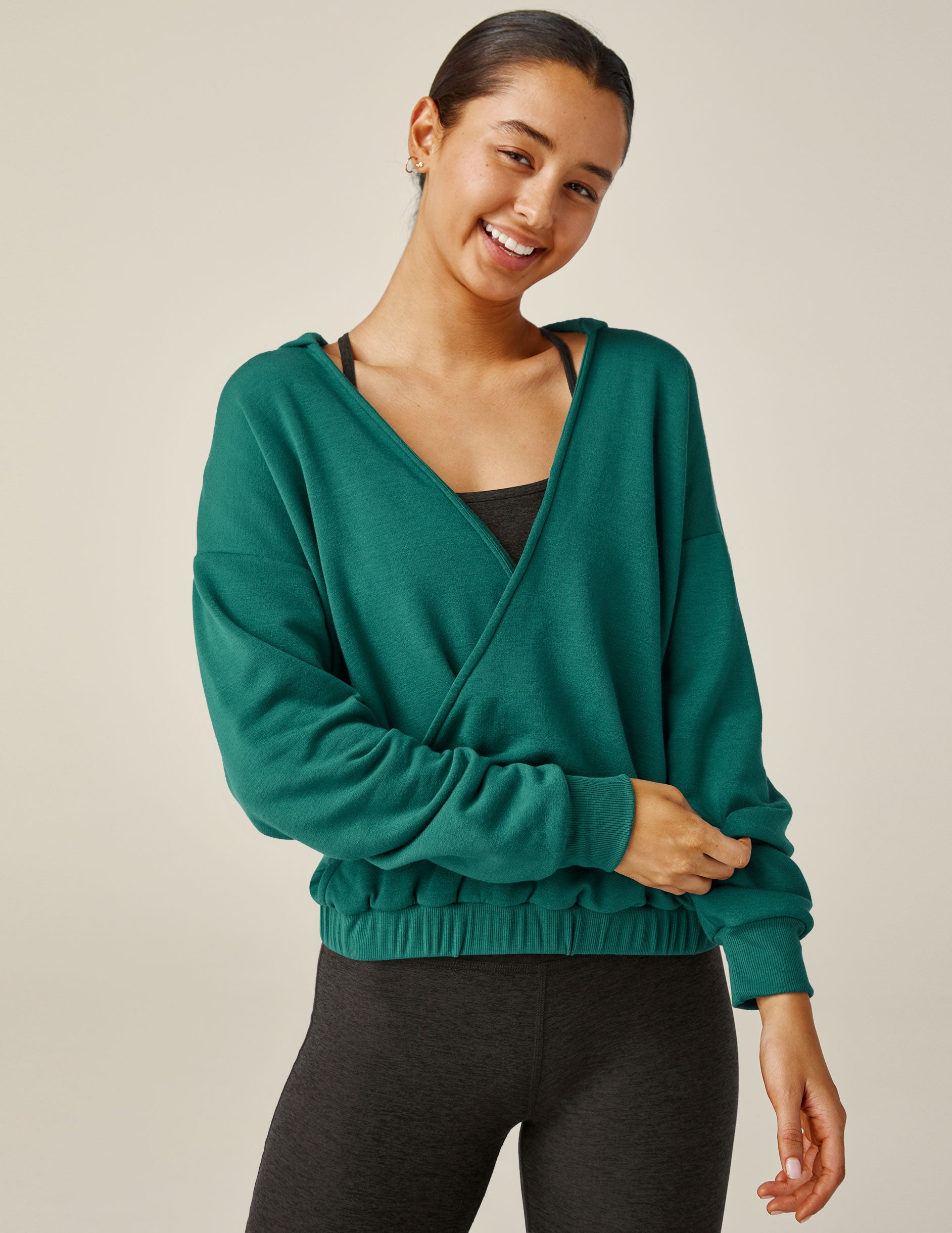 green hooded pullover with front crossover