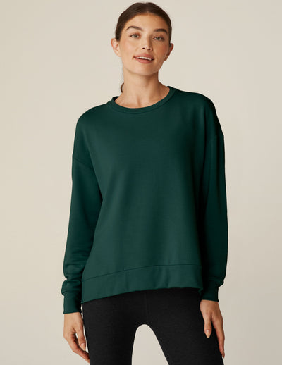 green long sleeve sweaters with side slits. 