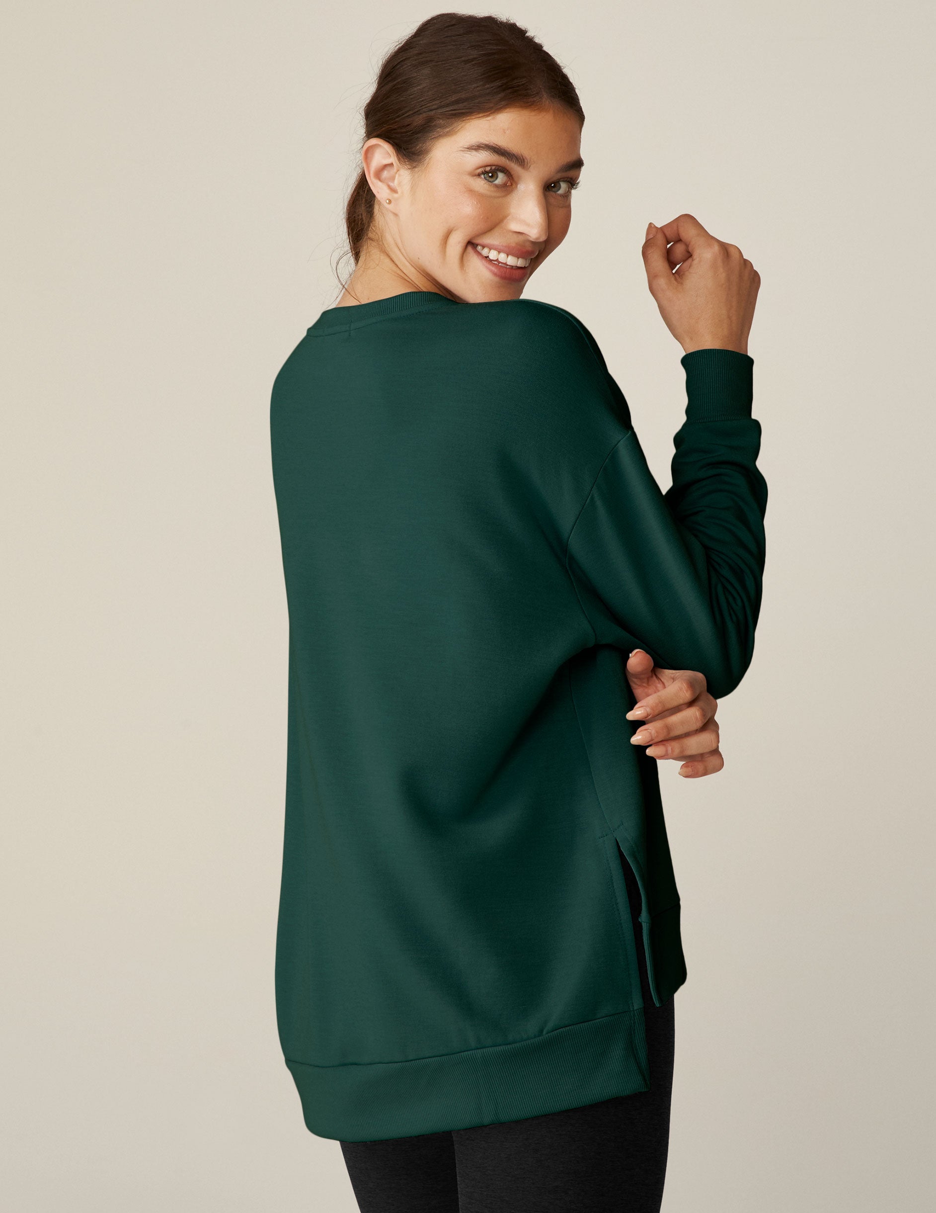 green long sleeve sweaters with side slits. 