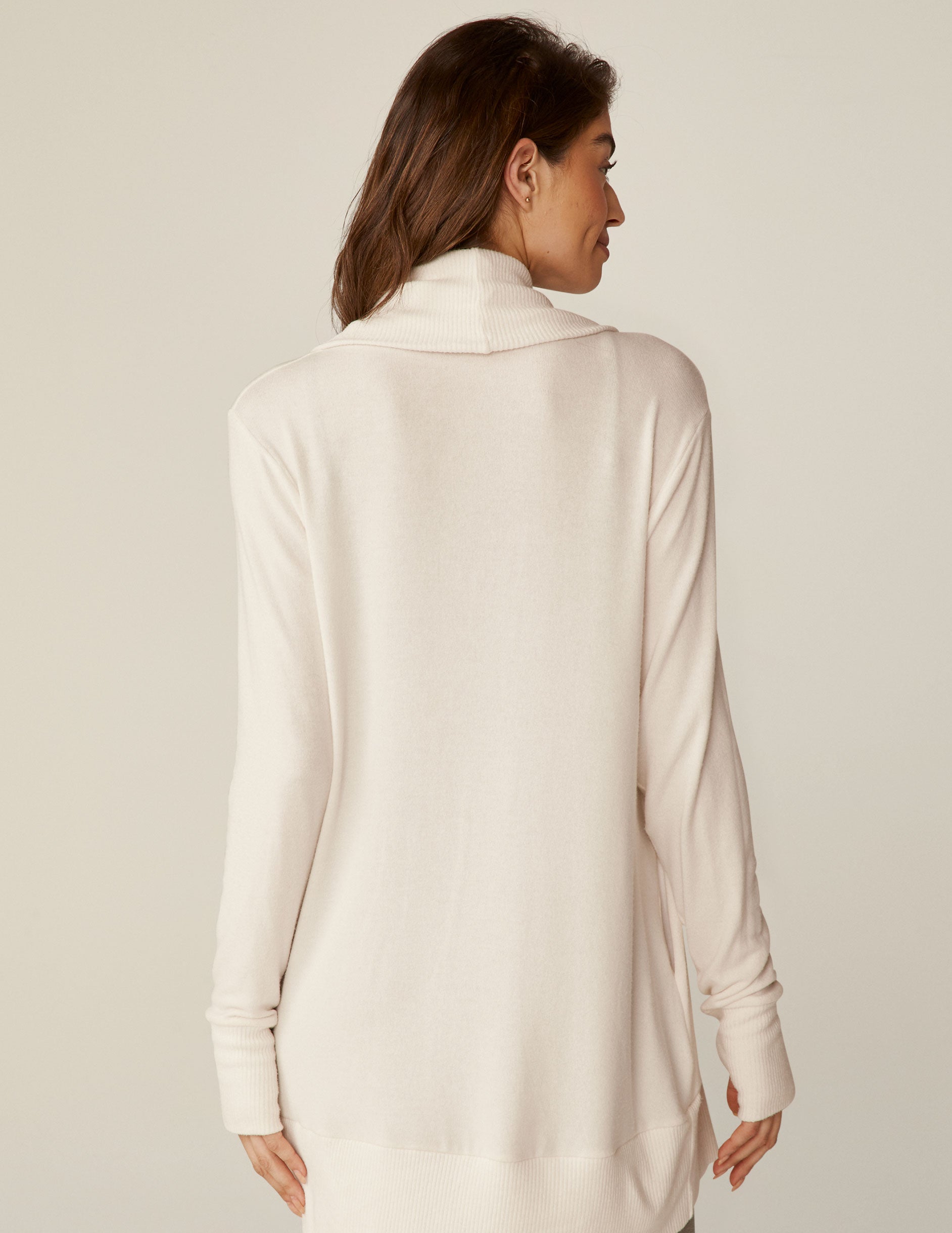 white cardigan with thumb holes