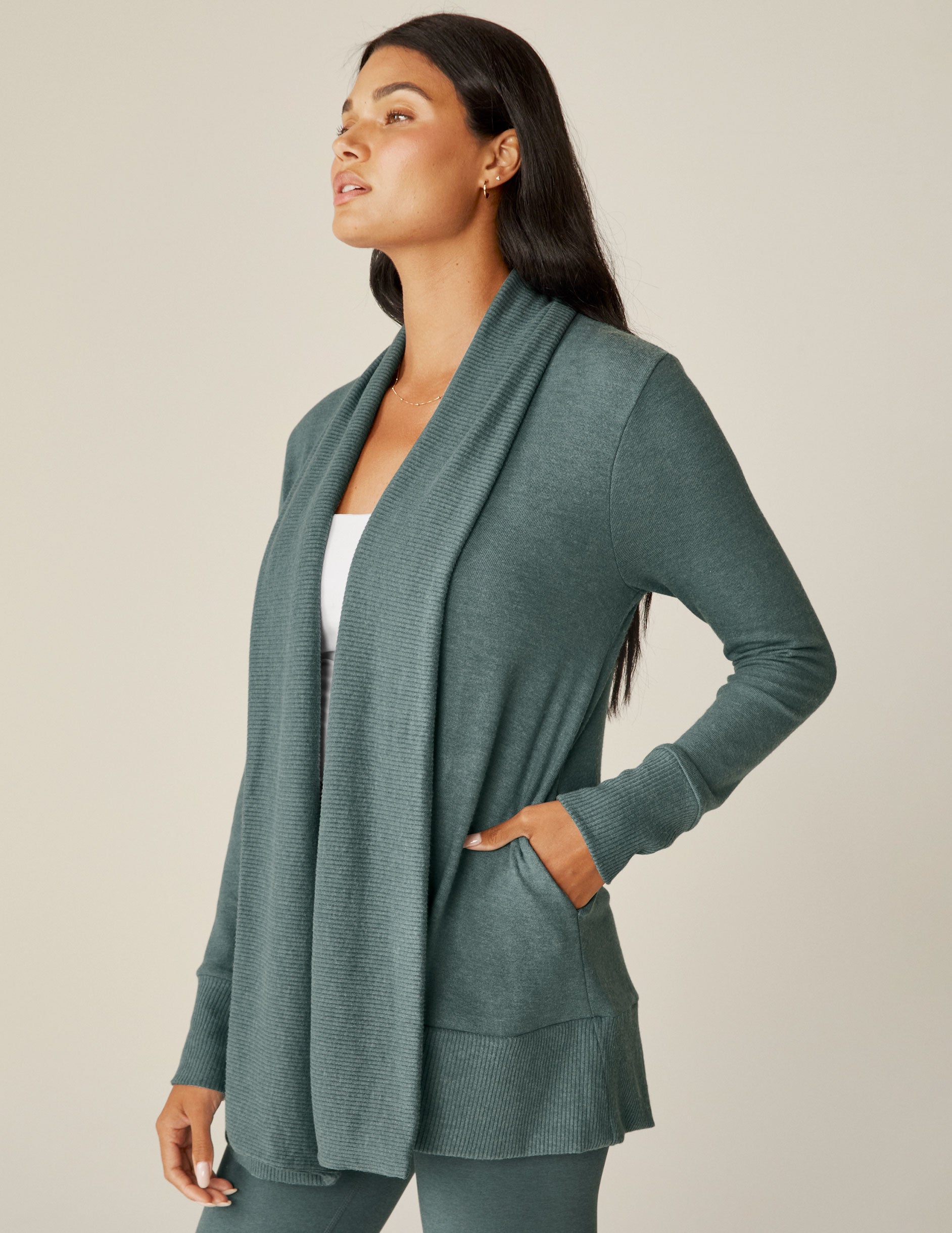 blue open front cardigan with thumbholes at the cuffs. 