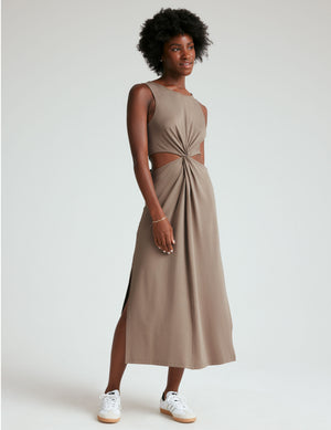brown tank midi dress with cutouts and a twist detailing at waist and side slits. 