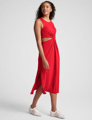 red midi length dress with a cutout detailing at waist. 