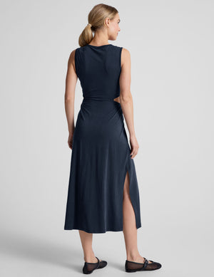 blue midi length thick strap tank dress with cutouts on sides of the waist and side slits on both sides of leg. 