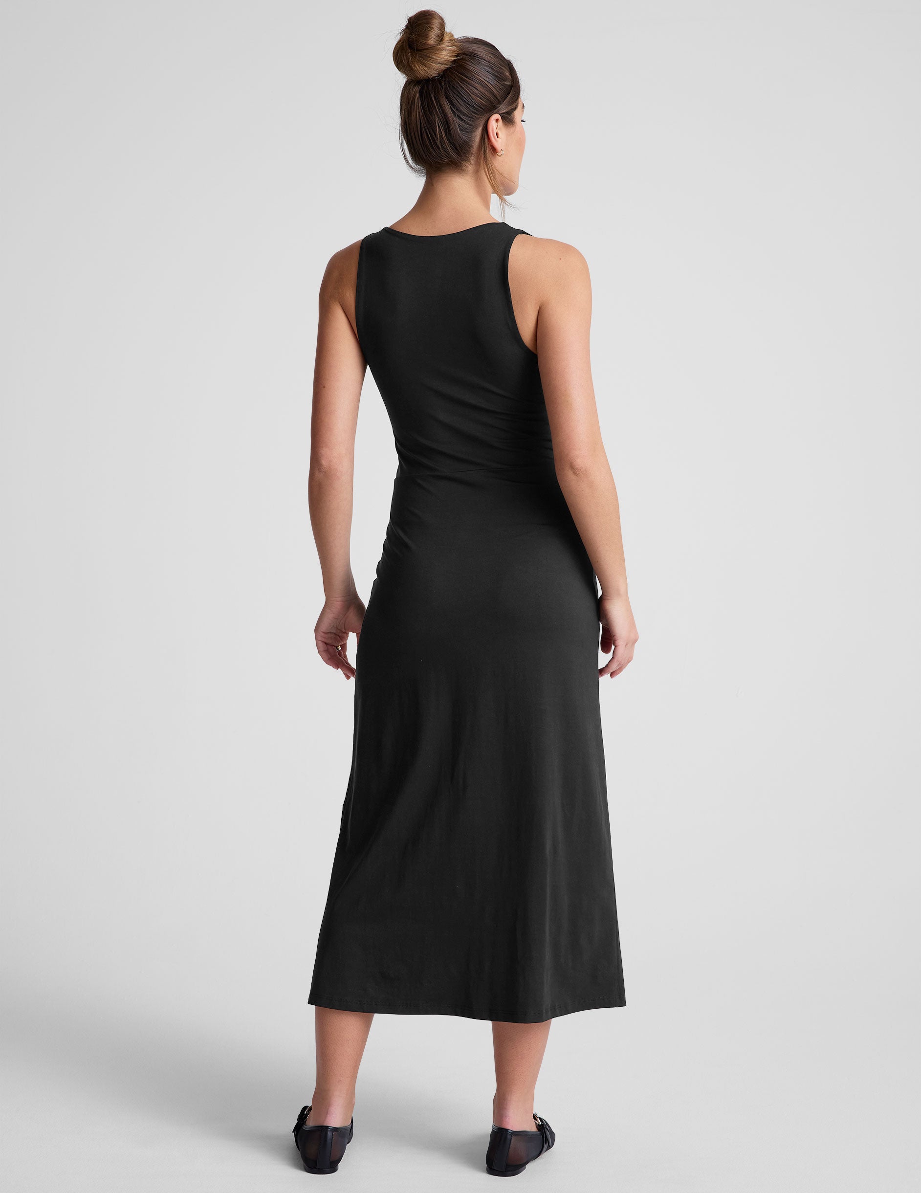 black midi dress with a square neckline and side slit. 