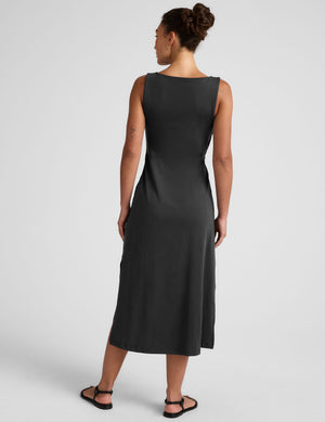black midi dress with a bateau neck and side twist. 