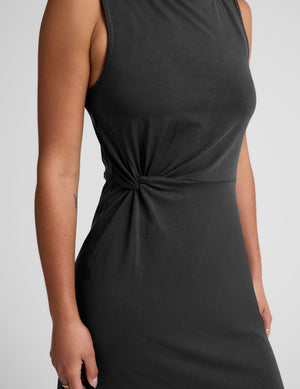 black midi dress with a bateau neck and side twist. 