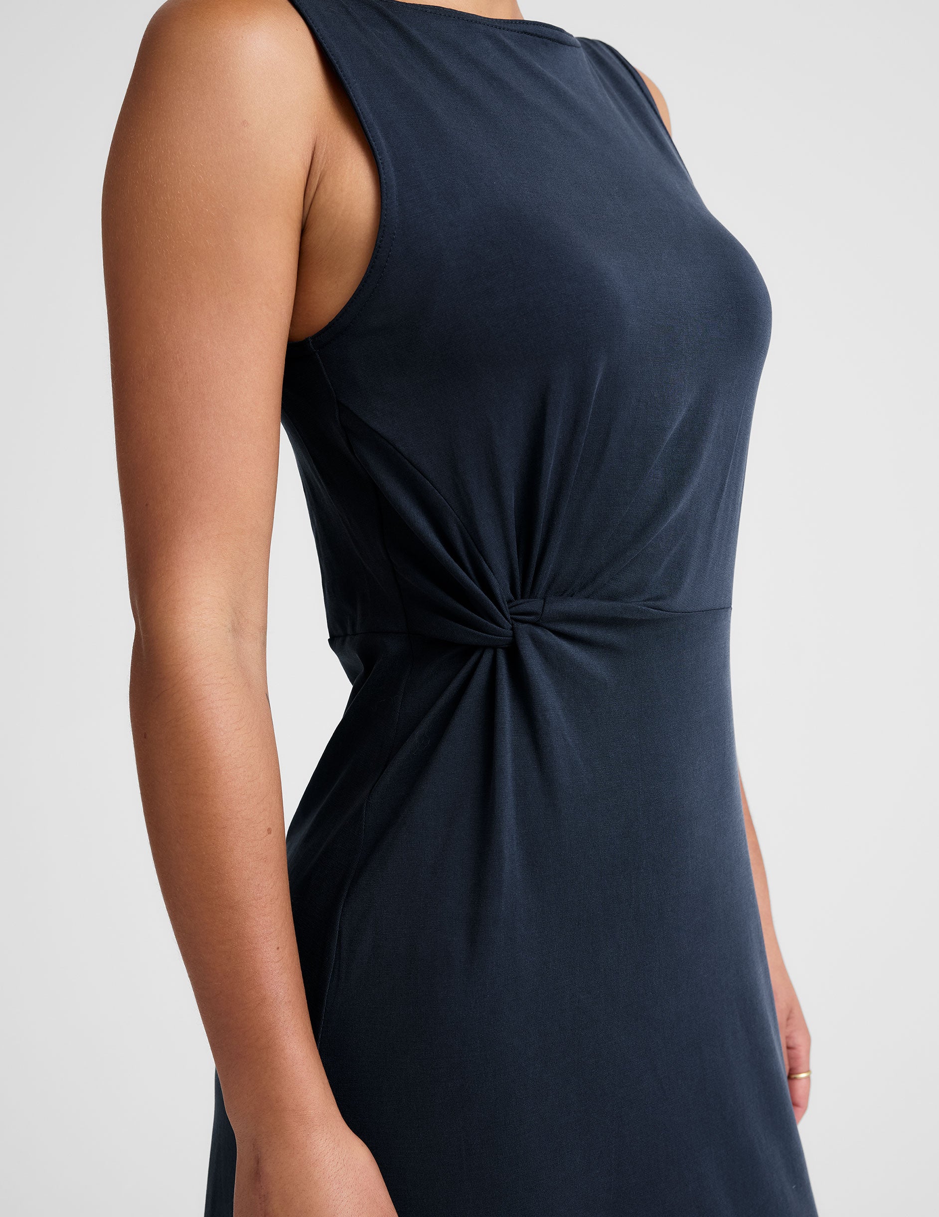 blue midi dress with a bateau neck and side twist. 