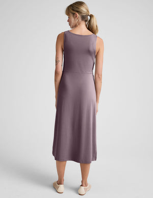 brown midi length dress with a side twist detail and side slit. 