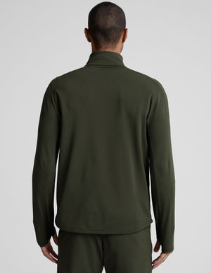 man wearing a green quarter zip pullover against a plain background. 