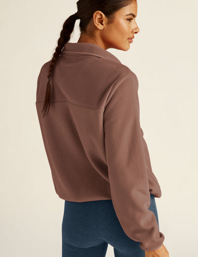 brown button-up jacket. 