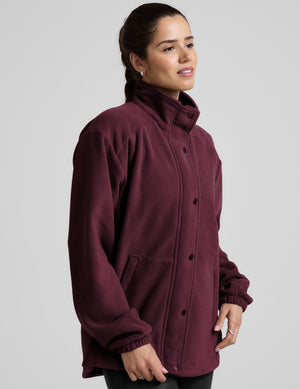 red fleece button up jacket with a full front zip and snap closures and pockets. 