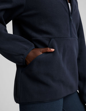 blue fleece quarter zip jacket with a kangaroo pocket. 