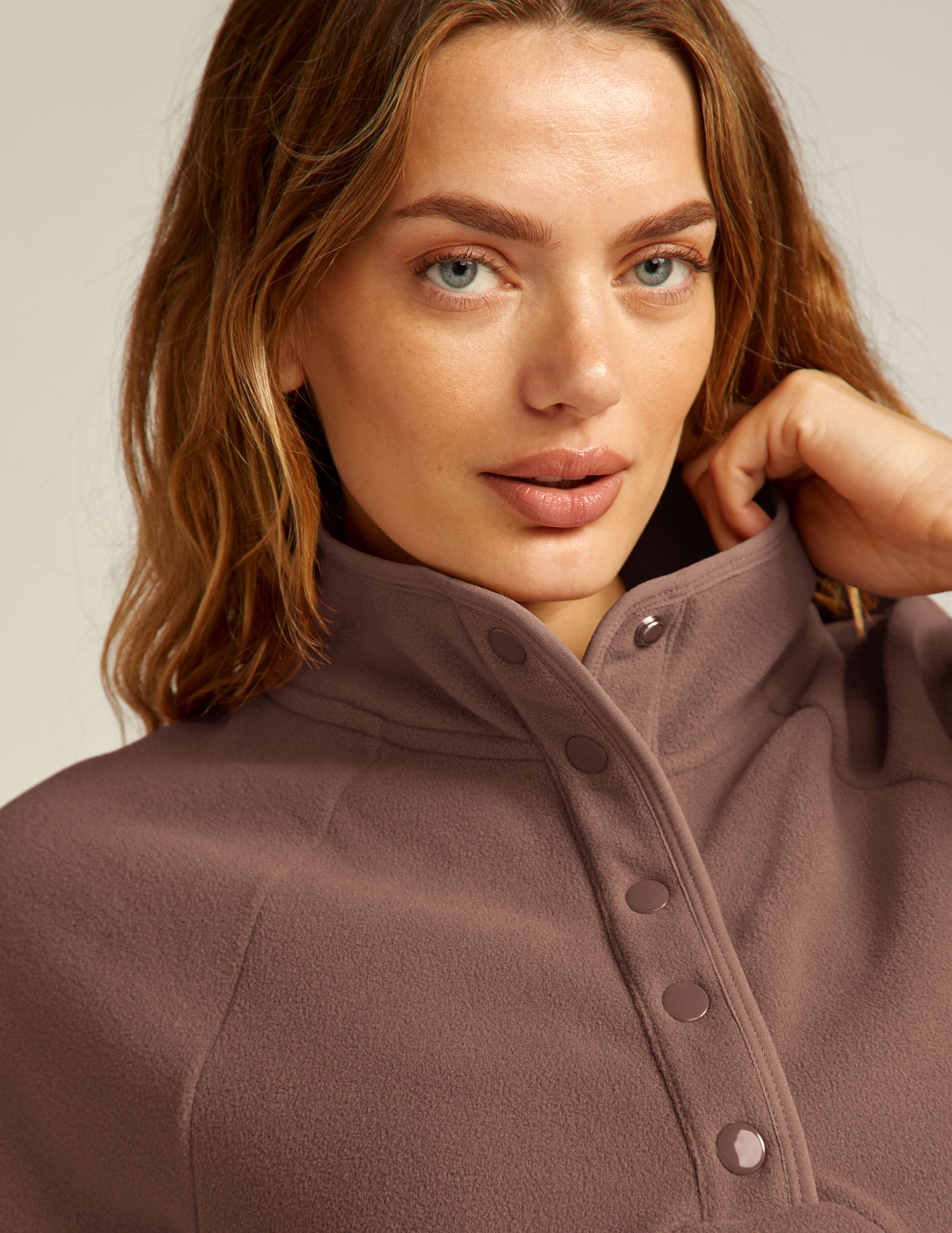 brown pullover with quarter buttons. 