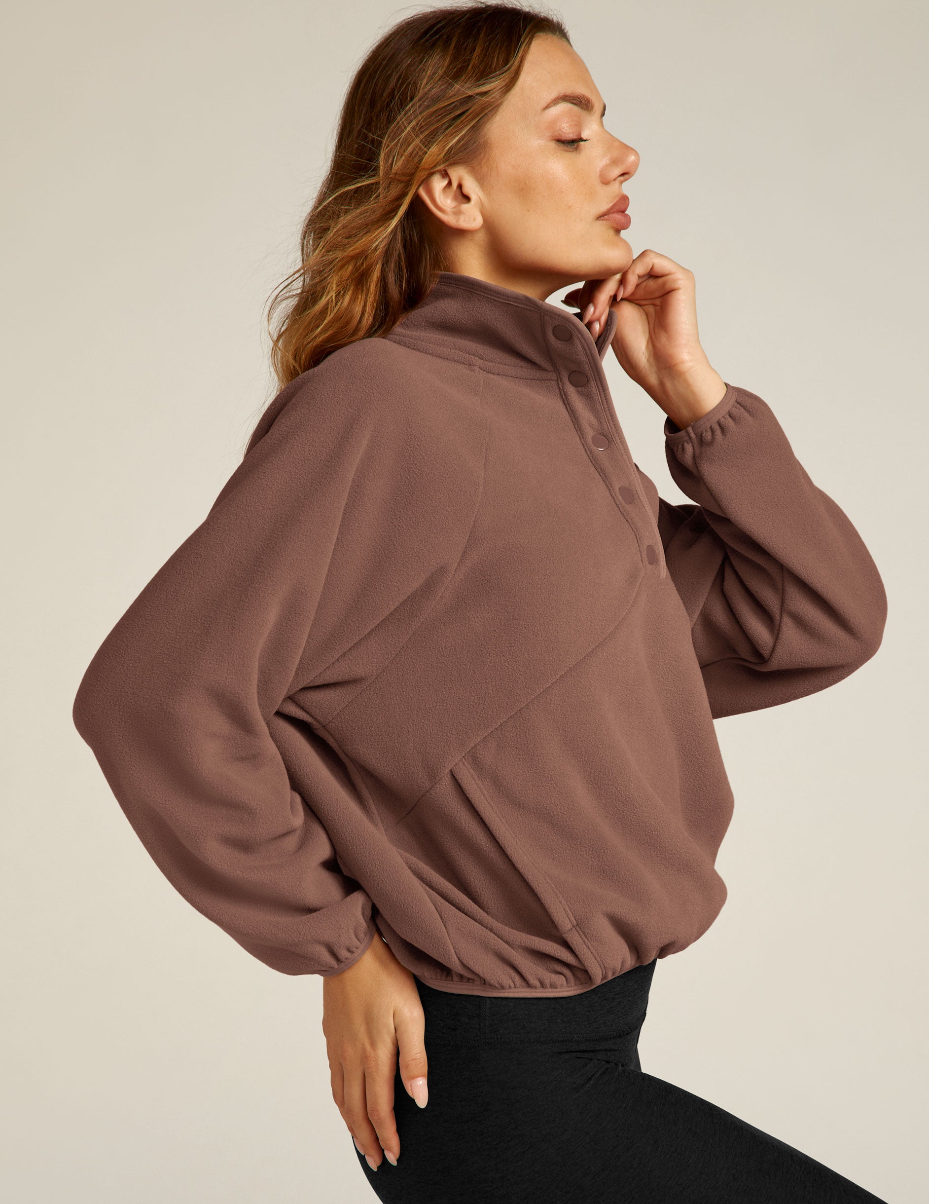 brown pullover with quarter buttons. 