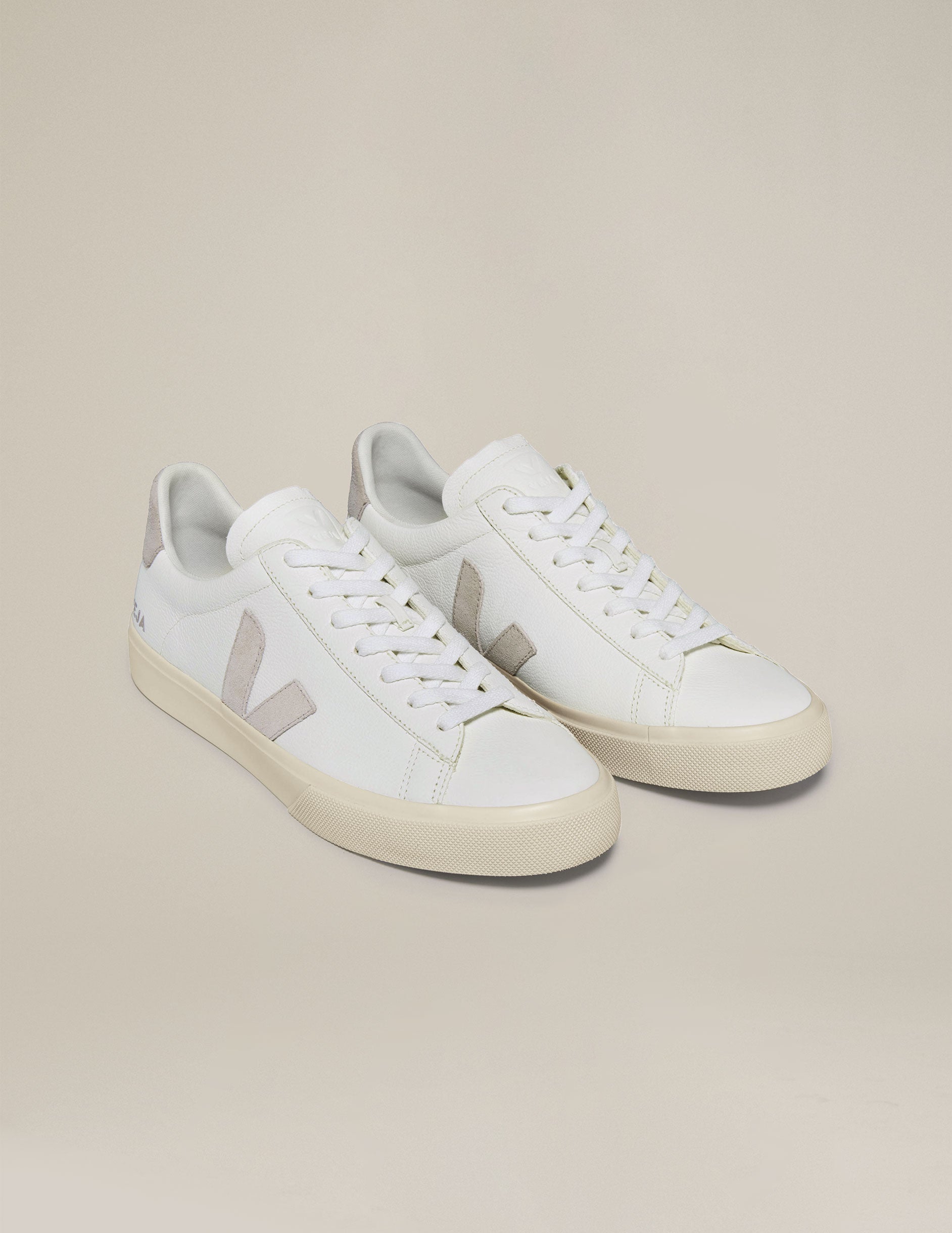 white and tan Veja sneakers.