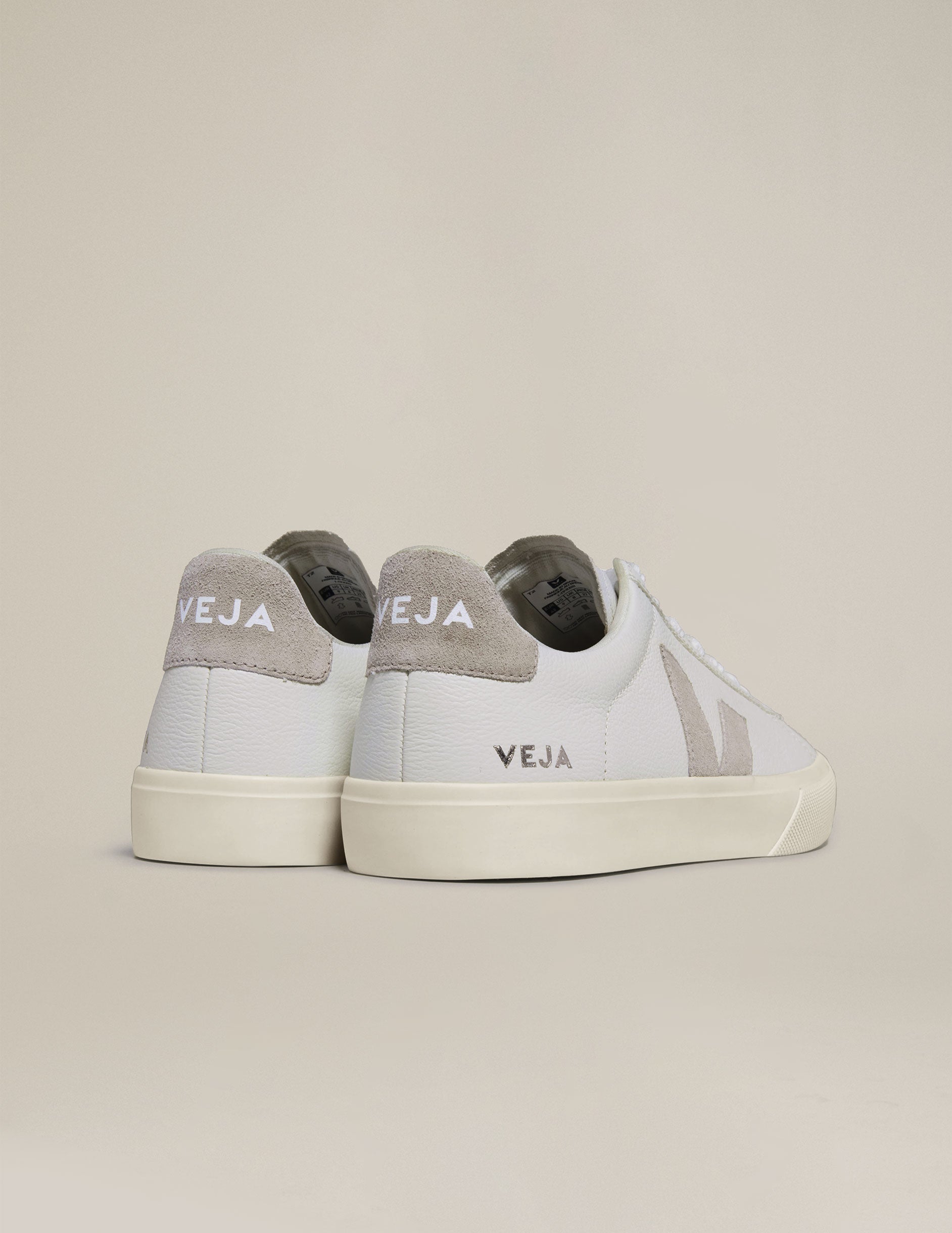 white and tan Veja sneakers.