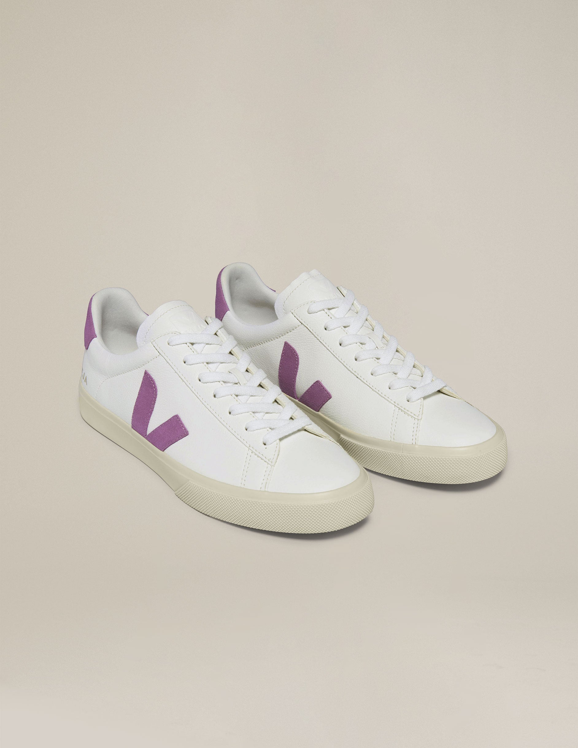 white and purple Veja sneakers.