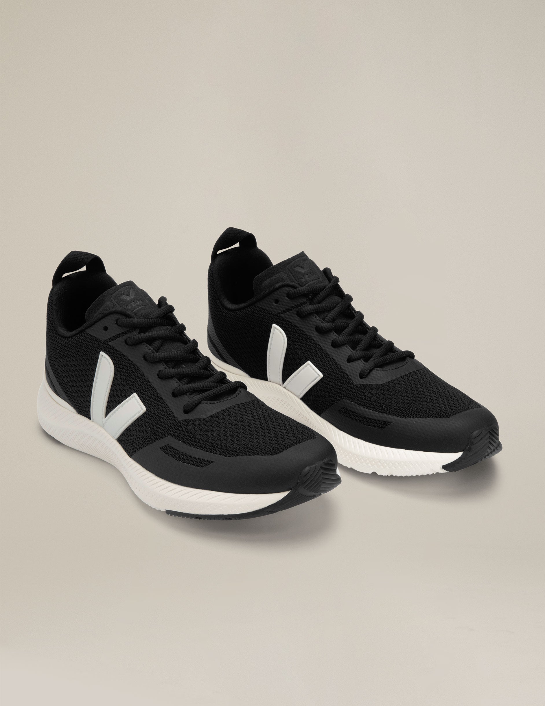 black and white Veja Impala running shoes. made in Brazil.