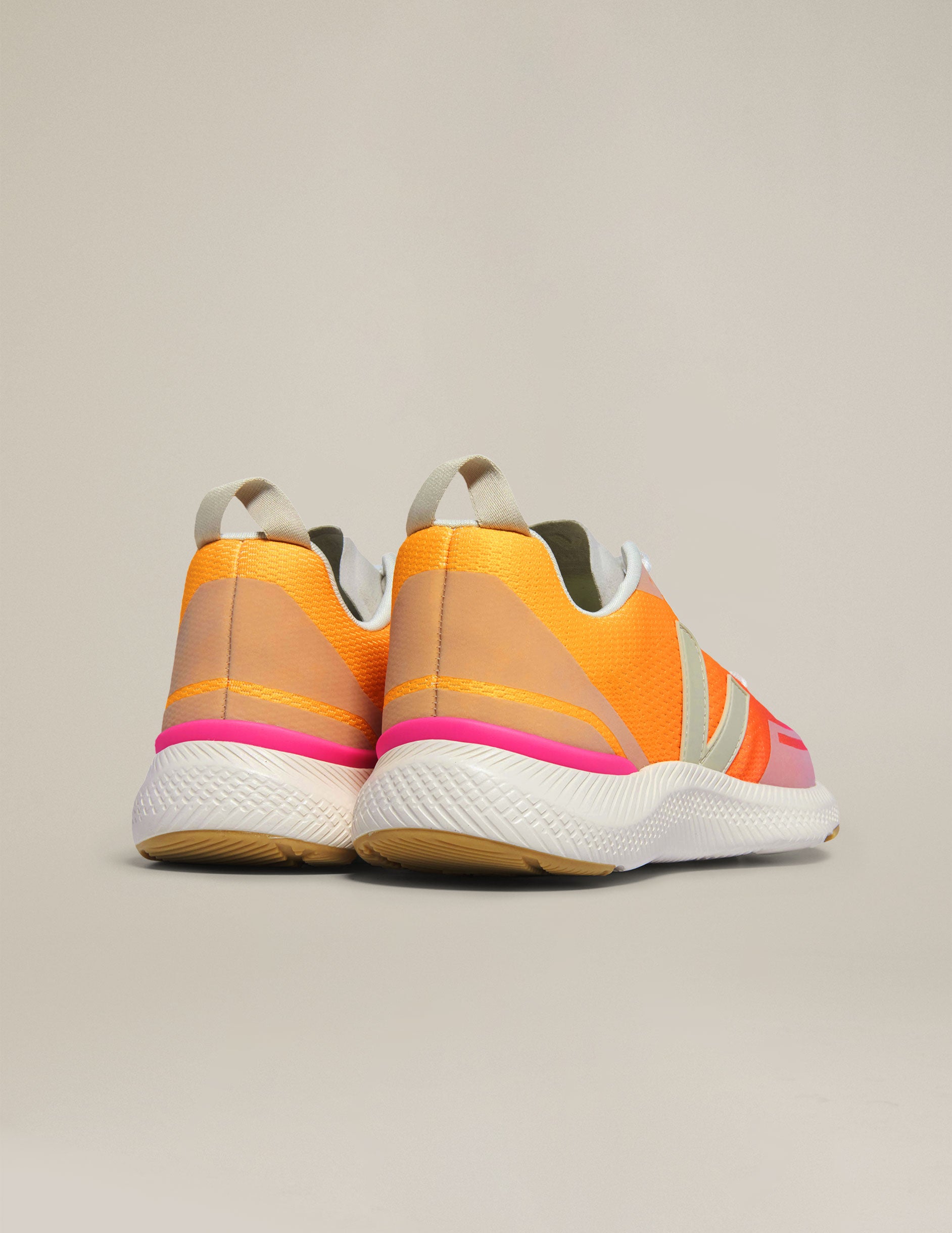 orange and pink lace up sneakers from Veja.