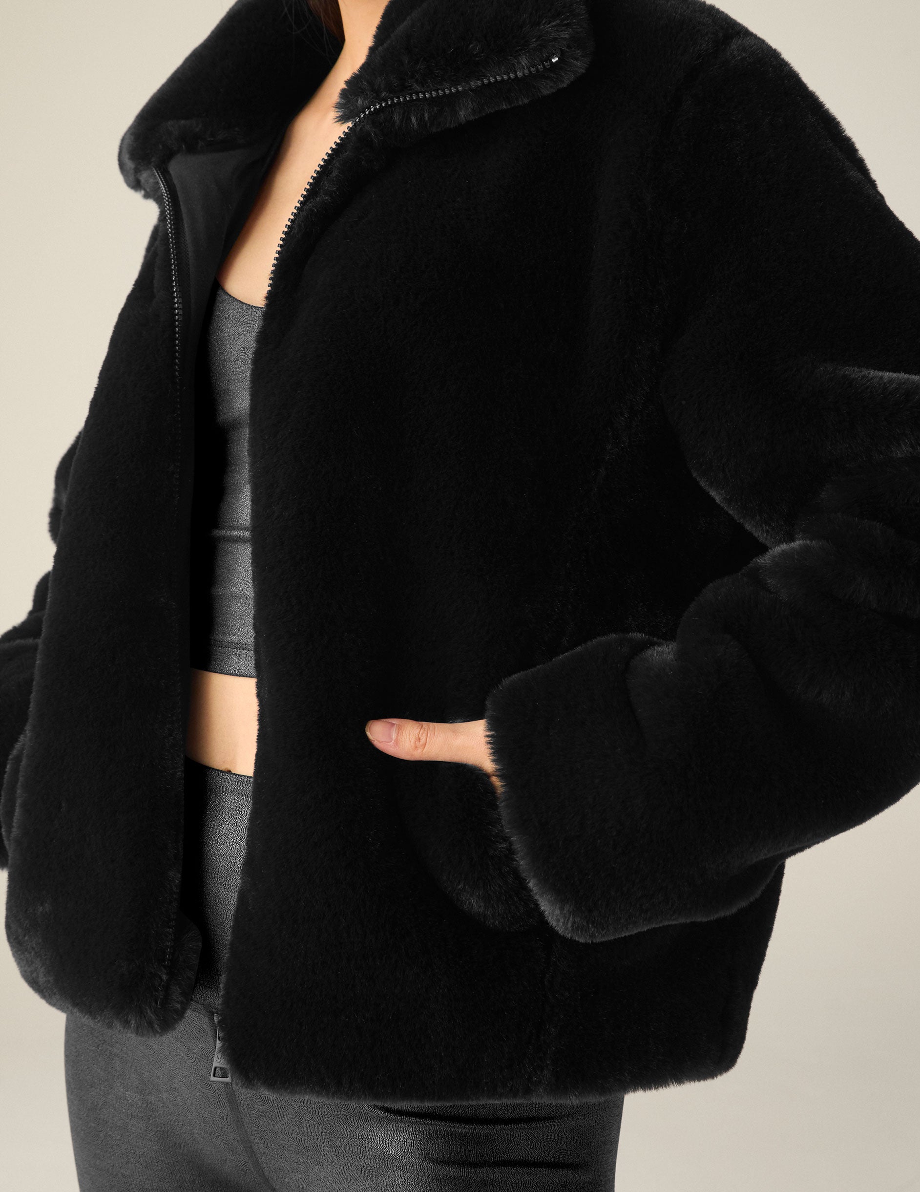 black faux fur zip-up collared jacket. 