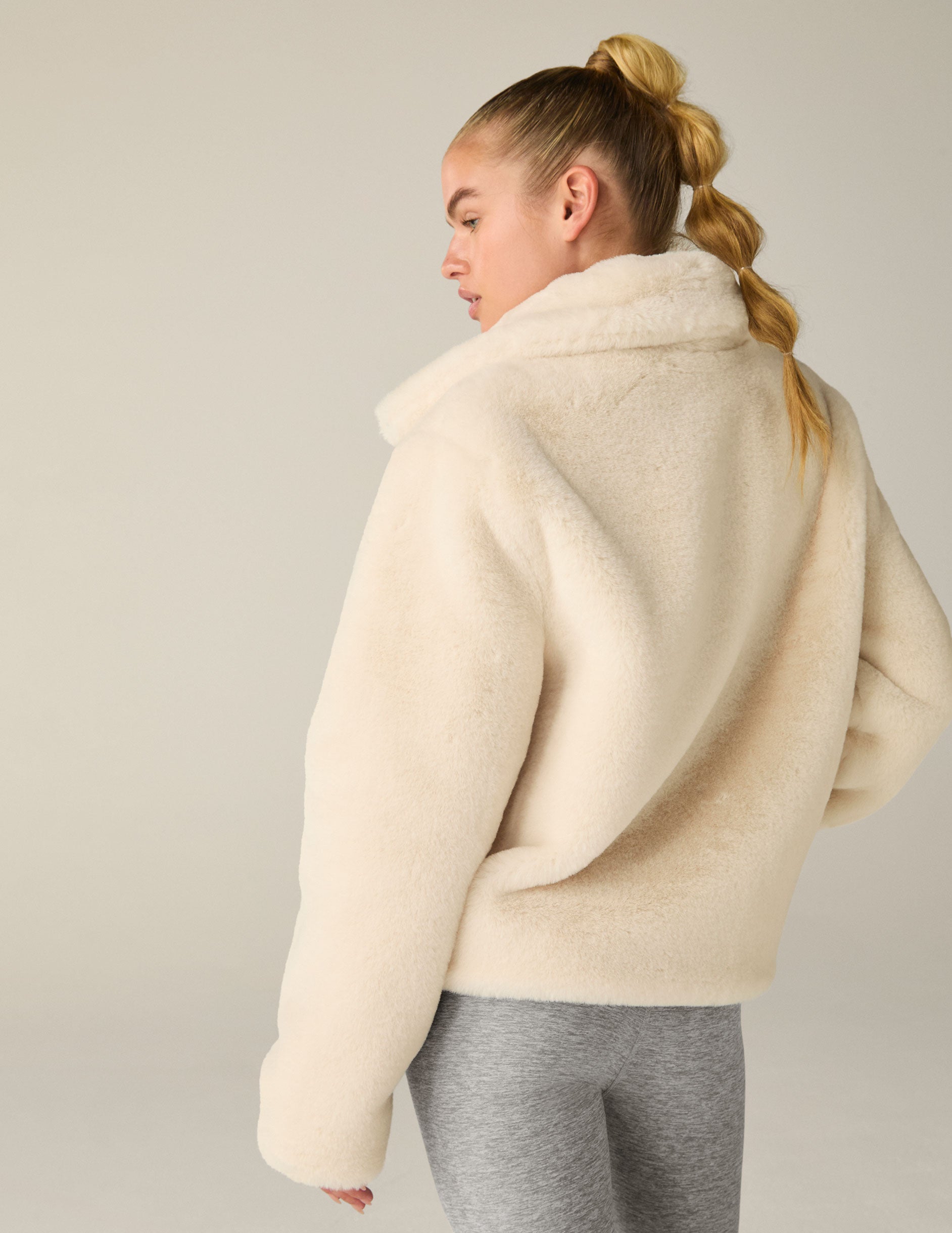 white faux fur zip-up collared jacket. 