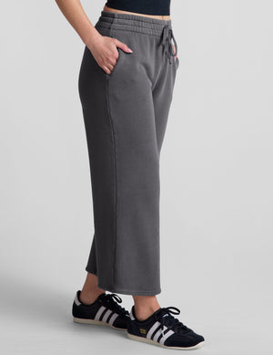 Cali Wide Leg Cropped Pant in dark gray featuring a relaxed fit, elastic drawstring waistband, and side seam pockets.