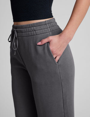 A close-up side view of the gray Cali Wide Leg Cropped Pant showing the elastic drawstring waistband and side seam pocket.
