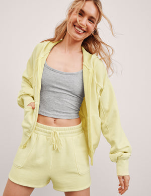 yellow zip-up sweatshirt with pockets. 