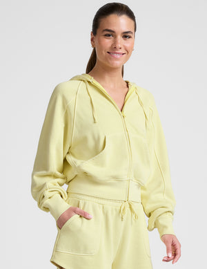 yellow zip-up sweatshirt with pockets. 
