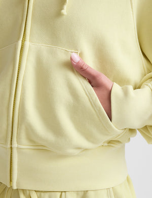 yellow zip-up sweatshirt with pockets. 