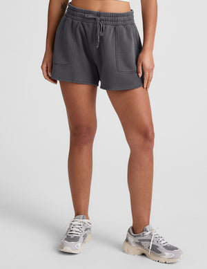 black shorts with patch pockets and a drawstring at waistband. 