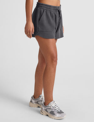 black shorts with patch pockets and a drawstring at waistband. 