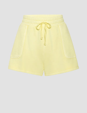 yellow terry shorts with pockets and a drawcord at waist. 