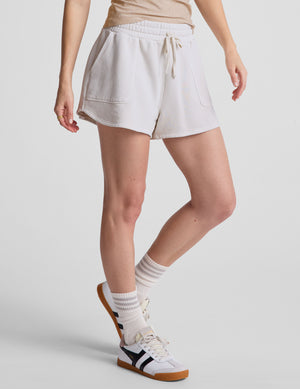 white relaxed fit terry shorts with patch pockets. 