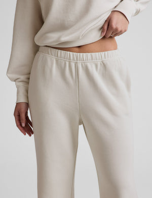 Close-up of cream Fade Out Mid-Rise Sweatpant featuring a gathered elastic waistband and side slant pockets.
