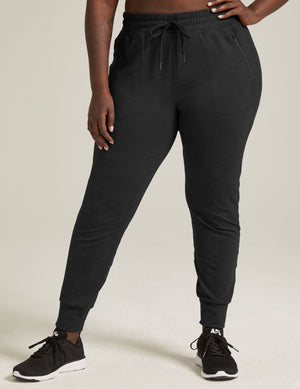 Slim-fit Heather Rib Street Jogger in black heather featuring a high drawstring waist, side zip pockets, and ankle cuffs.
